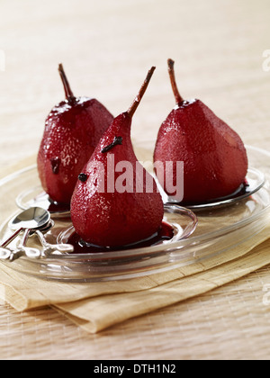 Pears poached in red wine with cloves Stock Photo