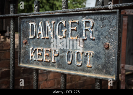 Rusty old danger keep out sign Stock Photo