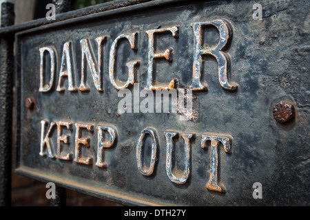 Rusty old danger keep out sign Stock Photo