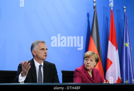 Berlin, Germany. 18th Feb, 2014. German Chancellor Angela Merkel (R) and visiting Swiss President Didier Burkhalter attend a press conference after their meeting at the Chancellery in Berlin, capital of Germany, on Feb. 18, 2014. © Zhang Fan/Xinhua/Alamy Live News Stock Photo