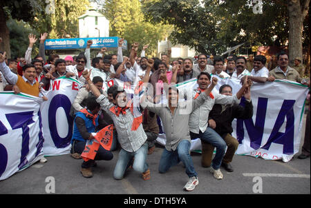 New Delhi, India. 18th February 2014. Supporters of Telengana state celebrate in New Delhi, India, Feb. 18, 2014. The Indian Parliament Tuesday passed a controversial bill to form a new state of Telangana, to be carved out of the southern state of Andhra Pradesh, amid chaos and temporary blackout of live TV telecast of the proceedings. Credit:  Xinhua/Alamy Live News Stock Photo