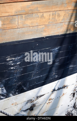 an old boat hull, painted in different colors Stock Photo