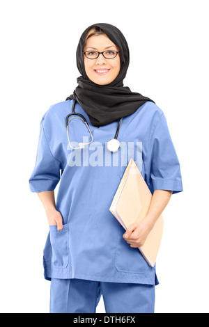 Muslim female doctor holding papers Stock Photo