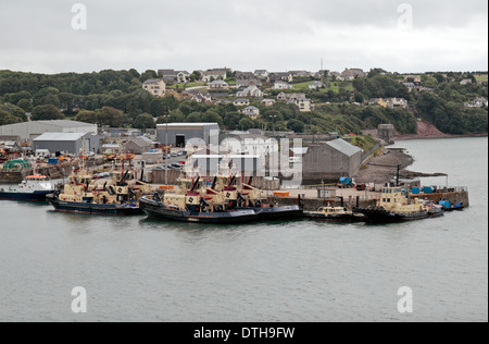 Tug boats moored near Pembroke Dock, Milford Haven, Pembrokeshire, Wales. Stock Photo