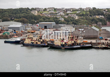 Tug boats moored near Pembroke Dock, Milford Haven, Pembrokeshire, Wales. Stock Photo