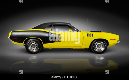 License and prints at MaximImages.com - Yellow 1972 Dodge Challenger retro muscle car side view isolated on black background with clipping path Stock Photo
