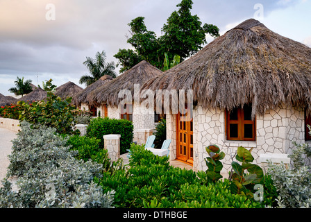 The Spa Retreat boutique hotel cottages with thatched roof. Stock Photo