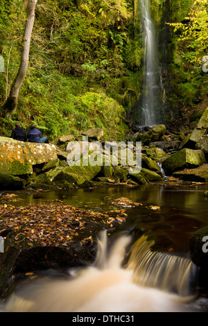 couple enjoying Mallyan Spout Waterfall Stock Photo