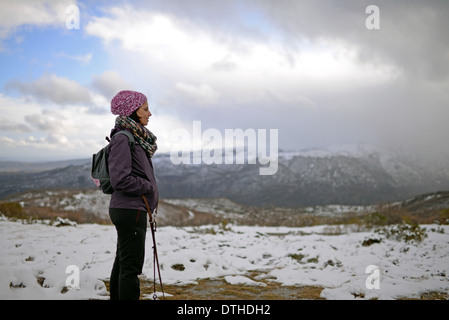 Portrait of young woman in snowy mountain Stock Photo