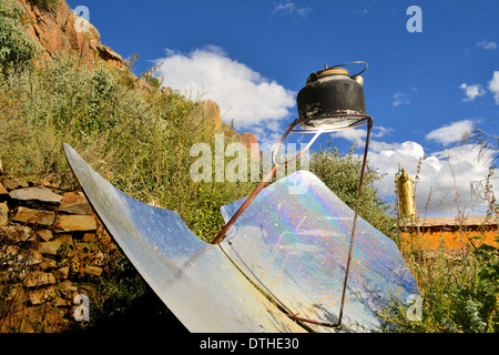 tea kettle boiling by solar parabolic reflector Stock Photo