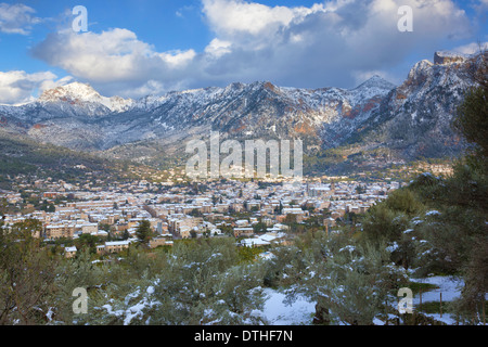 Sóller town and valley surrounded by Tramuntana mountains, after a Winter snowfall. Majorca, Balearic islands, Spain Stock Photo