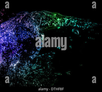 water color splash with bubbles isolated on black background Stock Photo