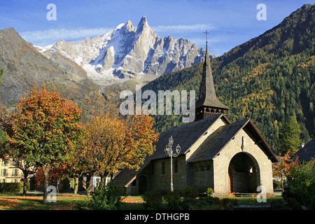 Aiguille Verte, Les Drus and the chapel of the mountain village of Les Praz de Chamonix, in the French Alps. Stock Photo