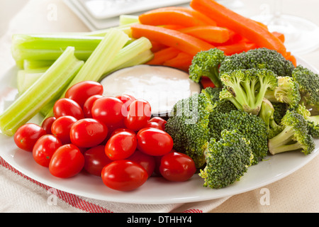 Organic Raw Vegetables with Ranch Dip with Tomatoes, Celery, Brocolli, and Carrots Stock Photo
