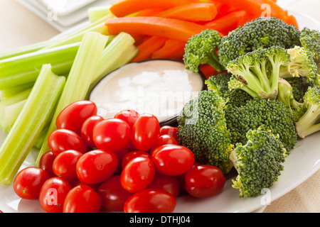 Organic Raw Vegetables with Ranch Dip with Tomatoes, Celery, Brocolli, and Carrots Stock Photo
