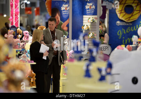 New York, NY, USA. 18th Feb, 2014. Exhibitors chat during the 111th American International Toy Fair in New York City, United States, Feb. 18, 2014. The toy fair kicked off on Tuesday, featuring over 150,000 entertainment products on dispaly presented by 1,100 companies around the world. Credit:  Xinhua/Alamy Live News Stock Photo