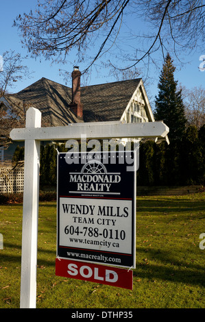 Sold real estate sign outside a house in Shaughnessy, Vancouver, BC, Canada Stock Photo