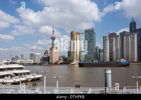 Pudong skyline and freighter on the Huangpu River, Shanghai, China Stock Photo