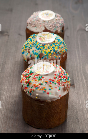 Three Easter cakes on a wooden table Stock Photo