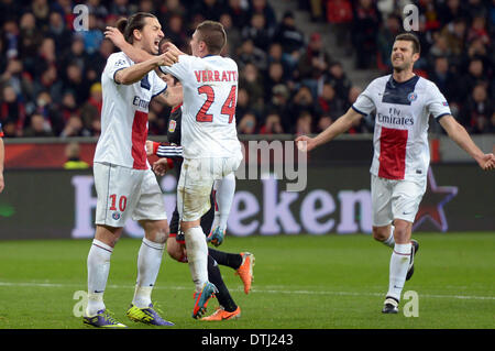 Leverkusen, Germany. 18th Feb, 2014. St.-Germains Zlatan Ibrahimovic (L-R) Marco Verratti and Thiago Motta cheer after scoring the 0-2 goal during the Champions League last round of sixteen match between Bayer 04 Leverkusen and Paris Saint-Germain in Leverkusen, Germany, 18 February 2014. Photo: Federico Gambarini/dpa/Alamy Live News Stock Photo