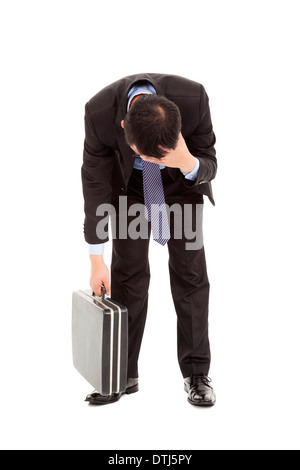 afflictive businessman stoop and hold his head over white Stock Photo