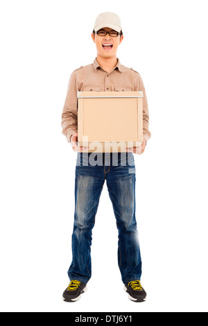full of delivery man holding parcel and standing in studio Stock Photo