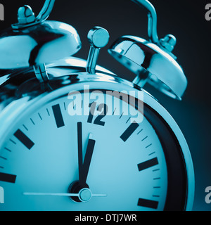 Alarm clock in blue night light Stock Photo