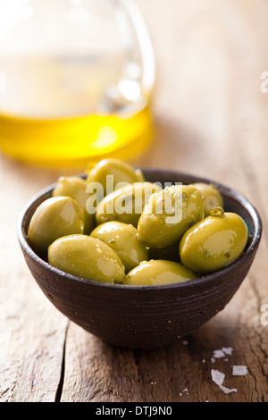 green marinated olives in bowl Stock Photo