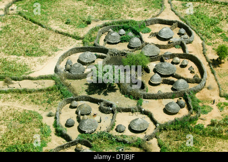 UGANDA, Karamoja, Kotido, karamojong pastoral tribe, aerial view of typical housing cluster Manyata, a homestead with huts and cattle ground, the wooden fencing is a protection from hostile tribes and cattle raiders Stock Photo