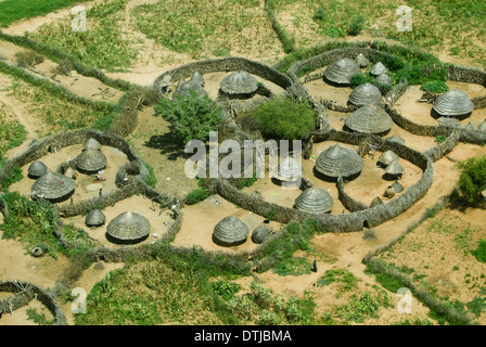 UGANDA, Karamoja, Kotido, karamojong pastoral tribe, aerial view of typical housing cluster Manyata, a homestead with huts and cattle ground, the wooden fencing is a protection from hostile tribes and cattle raiders Stock Photo