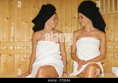 Two women at sauna wrapped in towel Stock Photo by ©CandyBoxImages