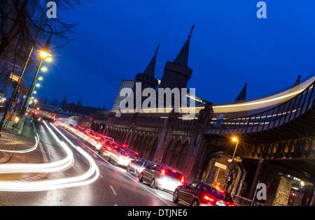 Berlin, Germany. 18th Feb, 2014. Headlights and the lights of the metro along the Oberbaum Bridge in the evening in Berlin, Germany, 18 February 2014. Photo: Paul Zinken/dpa/Alamy Live News Stock Photo