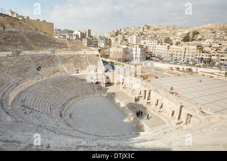 Ancient roman theater and city view with people in Amman, Jordan Stock Photo