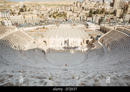Ancient roman theater and city view with people in Amman, Jordan Stock Photo