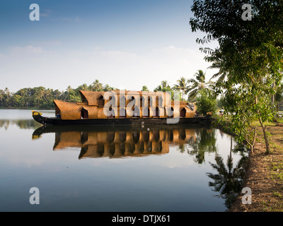 India, Kerala, backwaters, Kettuvallam boat trip houseboat reflected in backwater Stock Photo