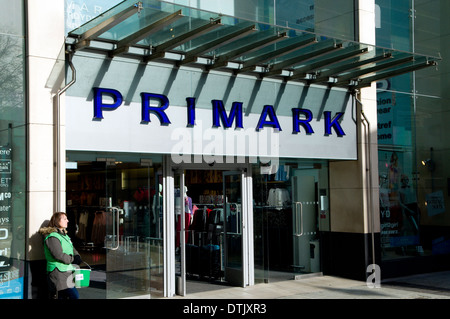 Primark shop and woman collecting for charity, Queen Street, Cardiff, Wales. Stock Photo