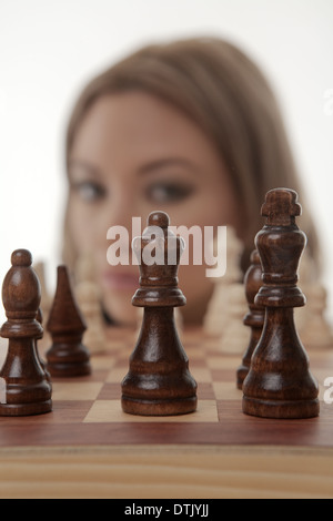 Image of a businesswoman playing chess shot in the studio Stock Photo