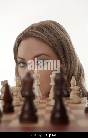 Image of a businesswoman playing chess shot in the studio Stock Photo