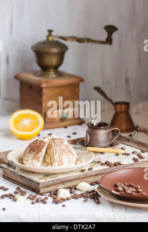 Delicious cheescake on ceramic plate with fresh orange and ceramic cup Stock Photo