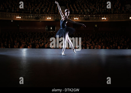 Ballet dancer performing on stage in theater Stock Photo