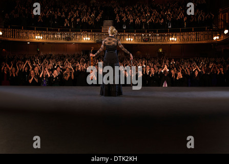 Violinist  performing on stage in theater Stock Photo