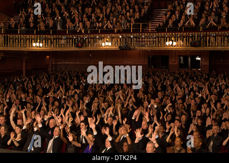 Audience cheering in theater Stock Photo