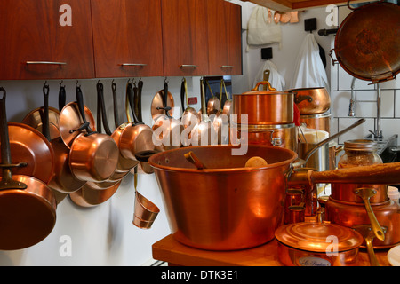 Copper pots and pans in a professional gourmet kitchen Stock Photo