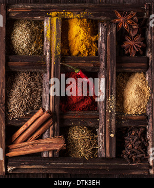 Top view on mix of spices in old wooden box Stock Photo