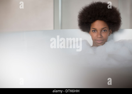 Woman relaxing in bath Stock Photo