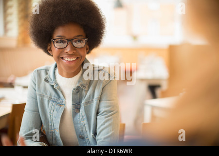 Woman smiling in cafe Stock Photo
