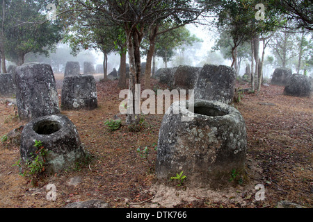 Megalithic Stone Urns  in Laos at The Plain of Jars Site 3 Stock Photo
