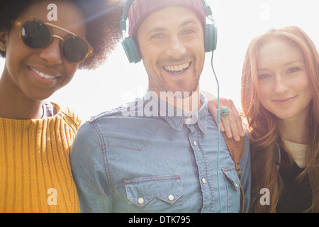 Friends smiling together outdoors Stock Photo