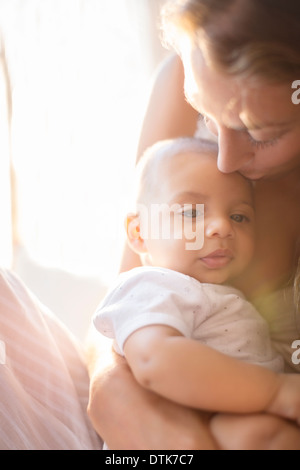 Mother holding baby boy Stock Photo