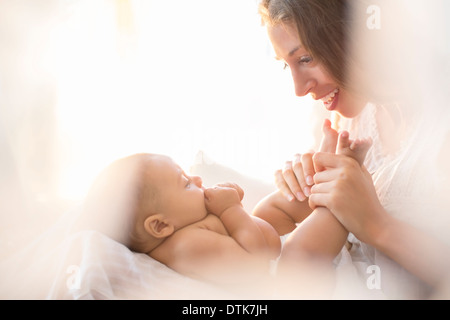 Mother playing with baby boy Stock Photo